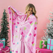 monogrammed blush and bright blanket on girls shoulder