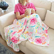 girl wrapped in personalized painted petals blanket close