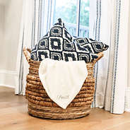 ivory plush blanket in basket