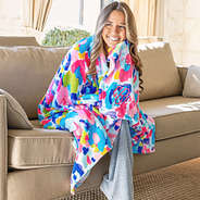 girl wrapped in personalized watercolor cheetah blanket