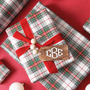 monogrammed wooden tag on christmas present