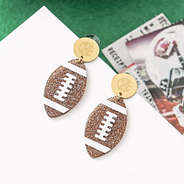 personalized football earrings on turf