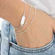 monogrammed silver multistrand bracelet on wrist