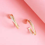 cable hoop earrings on pink background