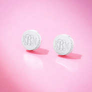 silver pave earrings on pink background