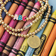 Gold monogrammed beaded teacher bracelets stack with crayons