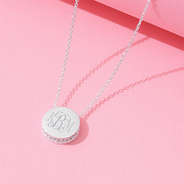 pave necklace on pink background