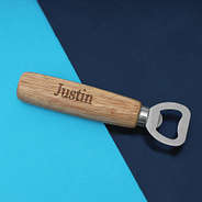 wooden bottle opener with name on blue background