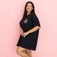 monogrammed sleep tee on model in front of pink paper