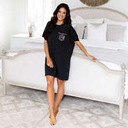 monogrammed sleep tee on Peyton standing in front of bed