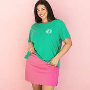 green golf tournament t-shirt on julia with pink skort
