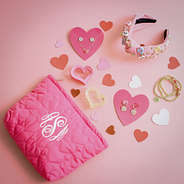 monogrammed heart cosmetic bag valentines flatlay