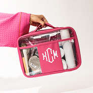 hot pink large clear toiletry case in hand