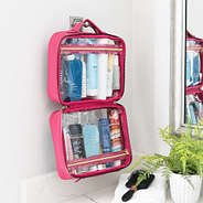 hot pink large clear toiletry case hanging up