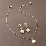 silver and gold cable hoop earrings with necklace