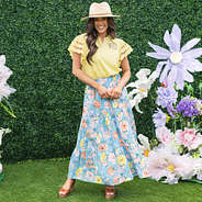 girl wearing personalized flutter sleeve top in soft yellow with flowers