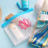 summer suncreens in monogrammed massive beach bags
