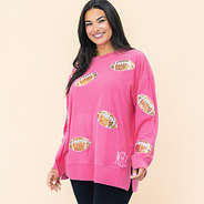 girl wearing monogrammed hot pink football sweatshirt up close