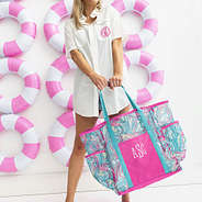 girl swinging flamingo splish splash mesh tote with pool rings