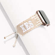 tan and white woven monogrammed apple watch band