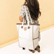 ivory rolling tote on shoulder