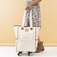 ivory rolling tote in hand