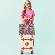 girl traveling with teal botanical monogrammed basic tote bag on luggage mint background