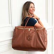 brown weekend travel bag on shoulder