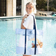 girl wearing blue shells clear beach tote on shoulder