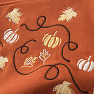 close up of thankful monogrammed sweatshirt fall leaves embroidery detail