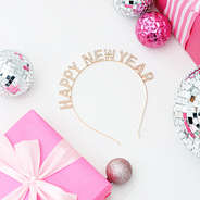 new year headband flatlay with gifts