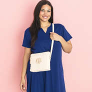 girl wearing monogrammed bone oversized crossbody purse