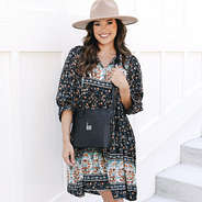 girl with black monogrammed classic crossbody over shoulder