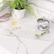monogrammed acrylic scalloped catch all tray on counter
