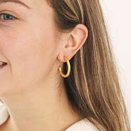 gold brushed hoop earrings in ears zoomed
