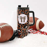 football bow sticker on cheetah travel tumbler