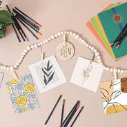 art clipped to monogrammed wooden photo garland