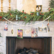 christmas cards on monogrammed photo garland on mantel