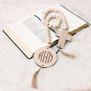 cross wooden bead engraved garland on bible