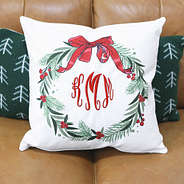 christmas monogrammed wreath pillow on couch