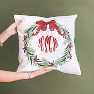 personalized christmas wreath pillow in hands