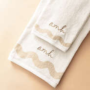 bath towel set on tan background