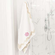 bath towel set on shower with pink octagonal monogram