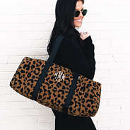 monogrammed sherpa hickory brown leopard duffel bag over shoulder