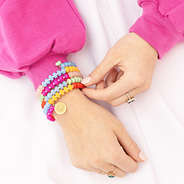 monogrammed coil bracelet on wrist