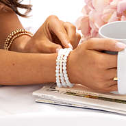 stretchy cross bracelet on wrist