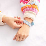 blue personalized woven bracelet on wrist