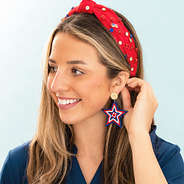 americana monogrammed patriotic earrings in ear