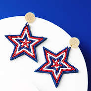patriotic earrings on blue and white background