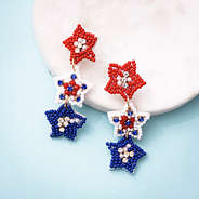 patriotic earrings on marble dish